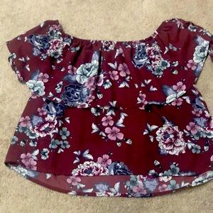 A maroon flower off the shoulder blouse